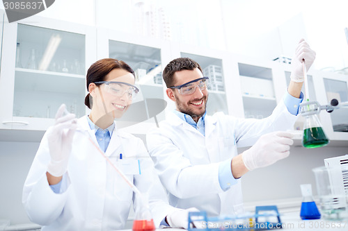 Image of young scientists making test or research in lab