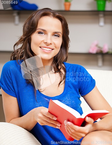 Image of happy and smiling woman with book
