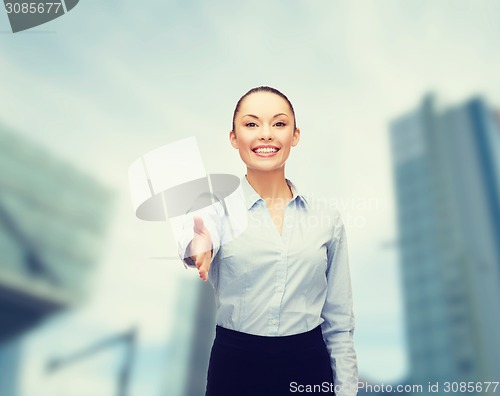 Image of businesswoman with opened hand ready for handshake