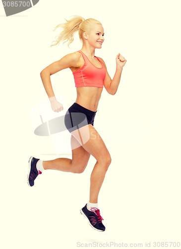 Image of sporty woman running or jumping