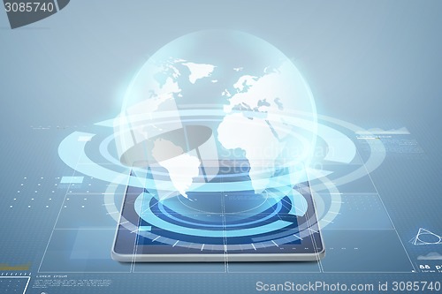 Image of tablet pc computer with globe projection