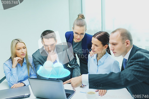 Image of business team with laptop having discussion