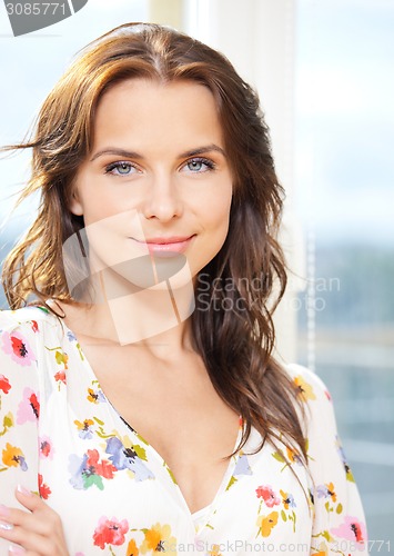 Image of happy woman at the window