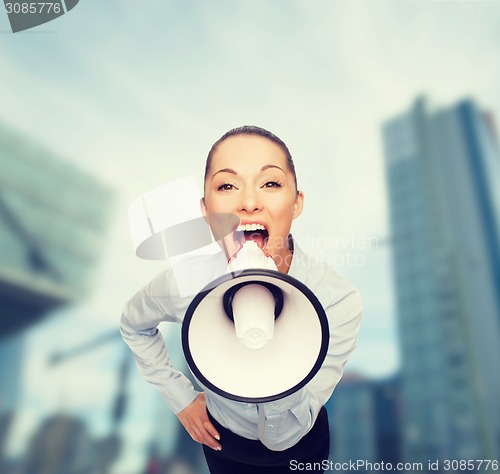 Image of screaming businesswoman with megaphone