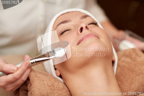 Image of close up of young woman and cosmetologist in spa