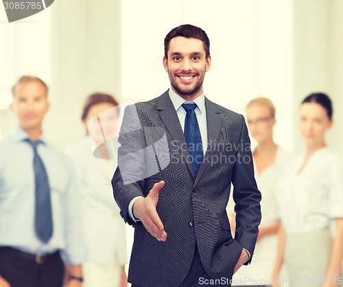 Image of businessman with open hand ready for handshake