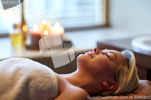 Image of young woman lying in spa