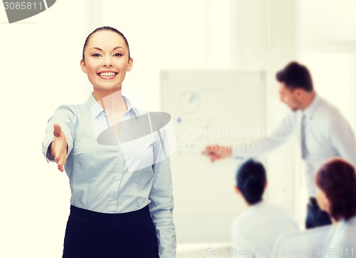 Image of businesswoman with opened hand ready for handshake