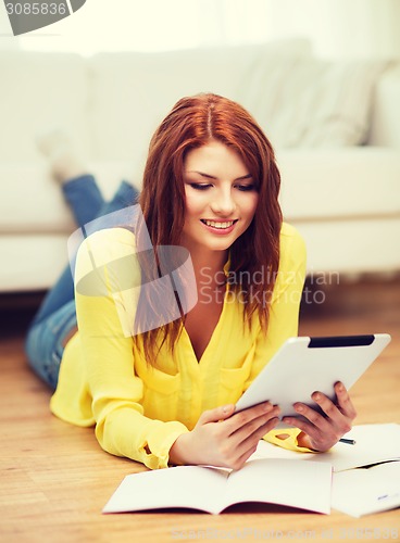 Image of student with tablet pc computer and notebooks