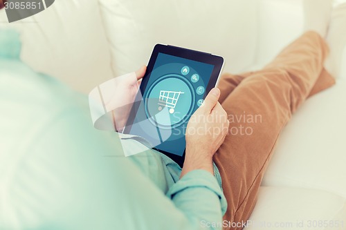 Image of close up of man with tablet pc computer at home