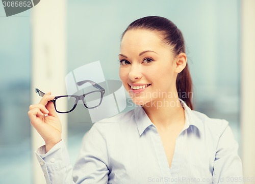 Image of laughing businesswoman with glasses