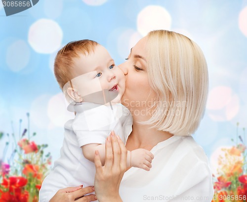 Image of happy mother with baby over natural background