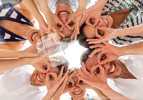 Image of smiling friends in circle