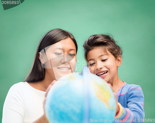 Image of mother and daughter with globe