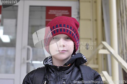 Image of Portrait of the boy of the teenager in a cap.