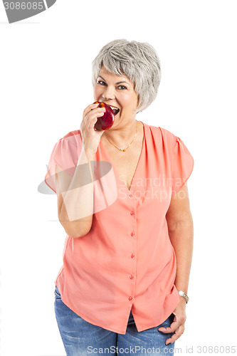 Image of Old woman eating an apple