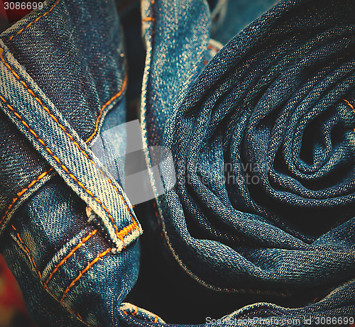 Image of jeans constricted into a roll