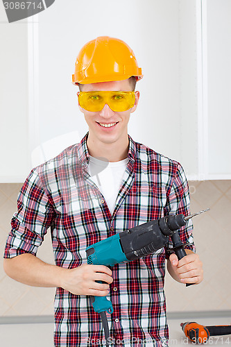 Image of worker with perforator