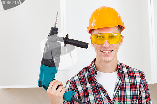 Image of smiling worker with rock-drill