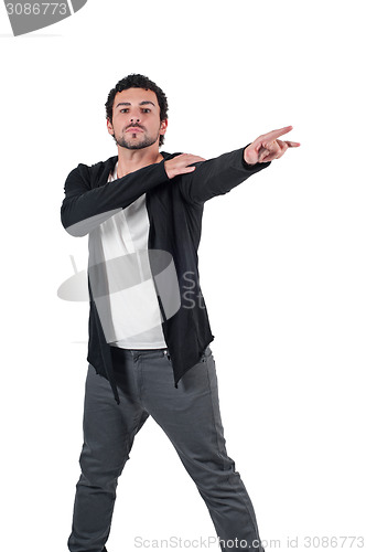 Image of Young handsome guy showing somewhere with finger