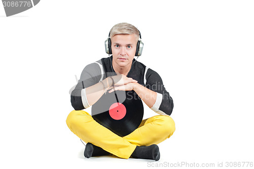 Image of Man with headphones and vinyl