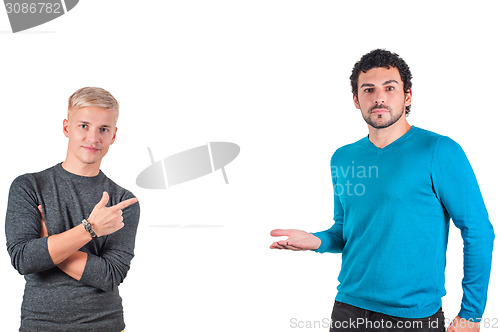 Image of Two handsome male showing somewhere with fingers