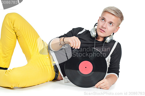 Image of Male with headphones and vinyl