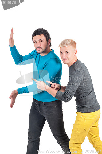 Image of Man holding invisible wall, another one showing
