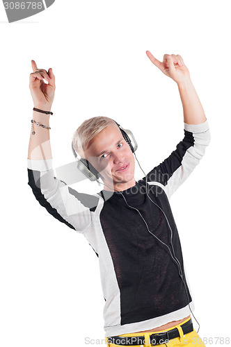 Image of Young handsome guy dancing with headphones 