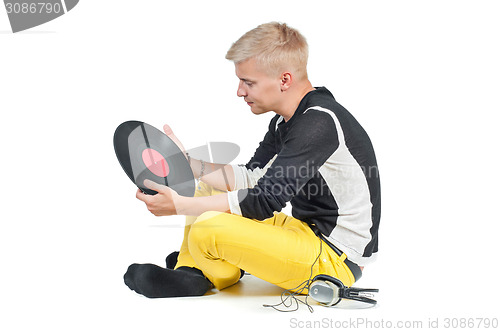 Image of Guy with headphones and vinyl