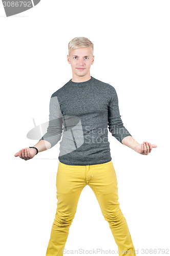 Image of Young handsome man holding something