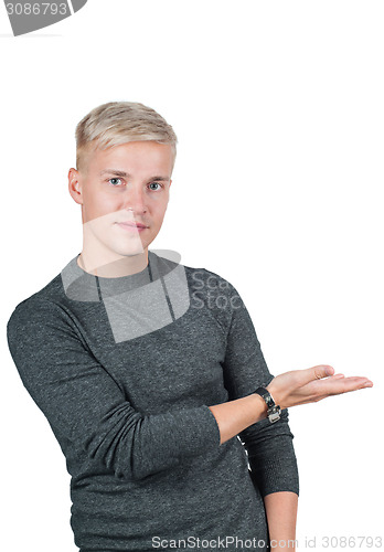 Image of Young handsome guy holding something