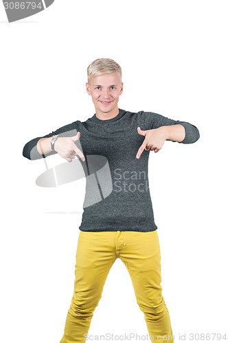 Image of Young handsome guy showing somewhere with fingers