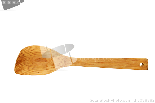 Image of wooden kitchen  spatula over white