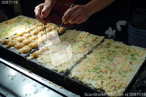 Image of The making of Takoyaki in Osaka 