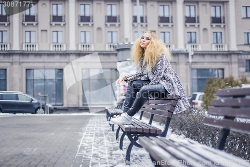 Image of Young lady with blonde hair in winted