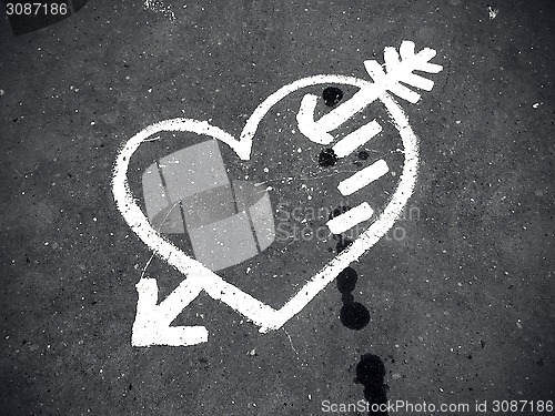 Image of Abstract love symbol on pavement