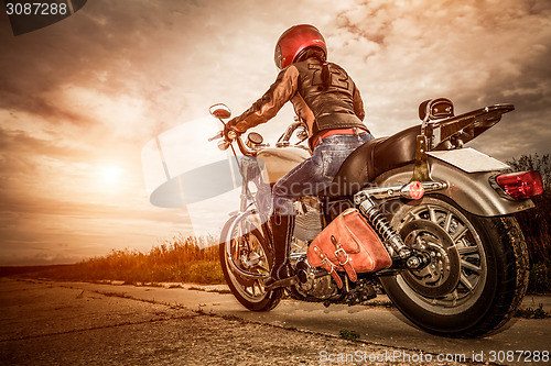 Image of Biker girl on a motorcycle