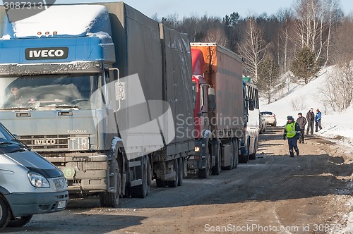 Image of Chain of cars waiting for opening of road