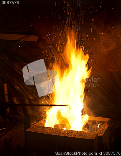 Image of smithy fire with sparks