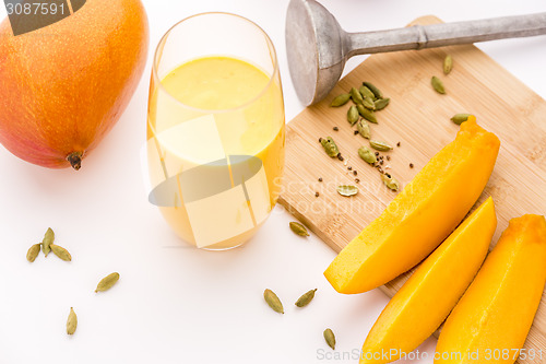 Image of Glass Mango Lassie, Crushed Cardamon And Pestle