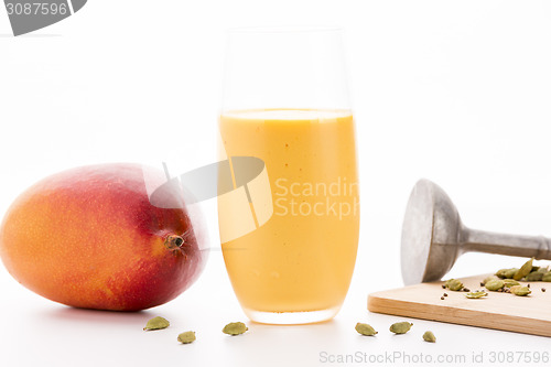 Image of One Glass Of Mango Lassi And A Whole Fruit