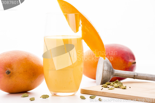 Image of Decorated Mango Lassie, Cardamom And Two Mangos