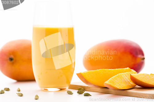 Image of Cut Mango Pieces, Cardamon And Fruit Shake