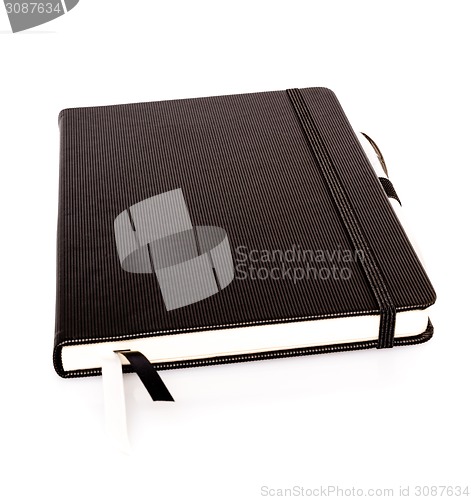 Image of Notebook with pen 