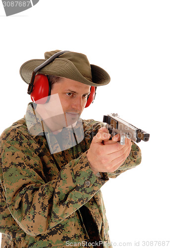 Image of Soldier pointing a pistol.