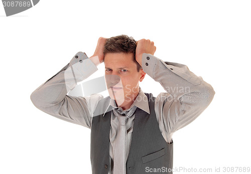 Image of Man scratching his head.