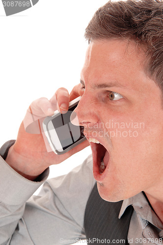 Image of Man screaming in cell phone.