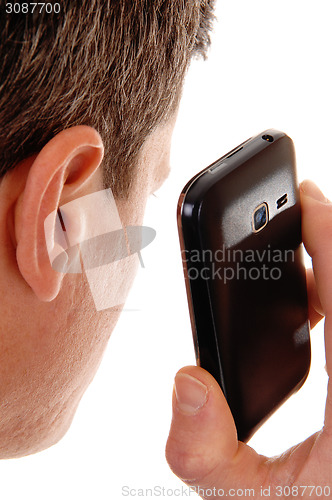 Image of Man holding cell phone.