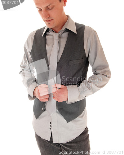 Image of Man getting dressed.